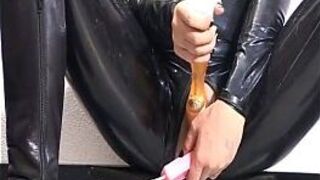 Hottie in latex toying her pussy - porn video