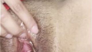 Pretty Asian pleasuring herself with some help - porn video